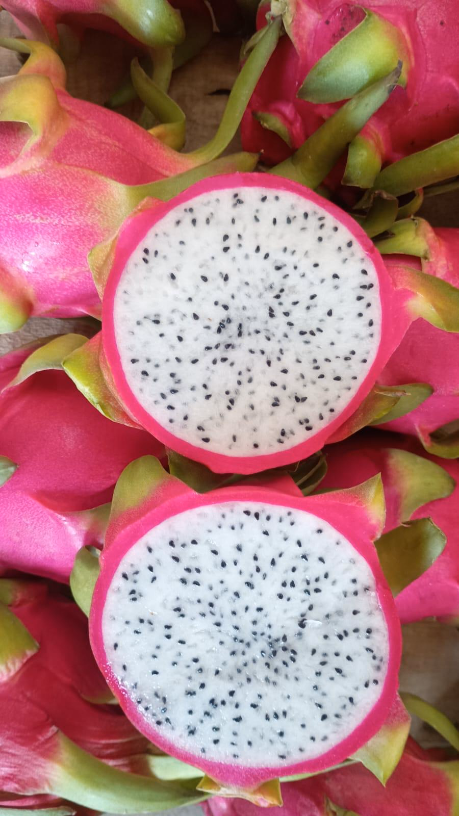 A dragon fruit cut open to show the flesh