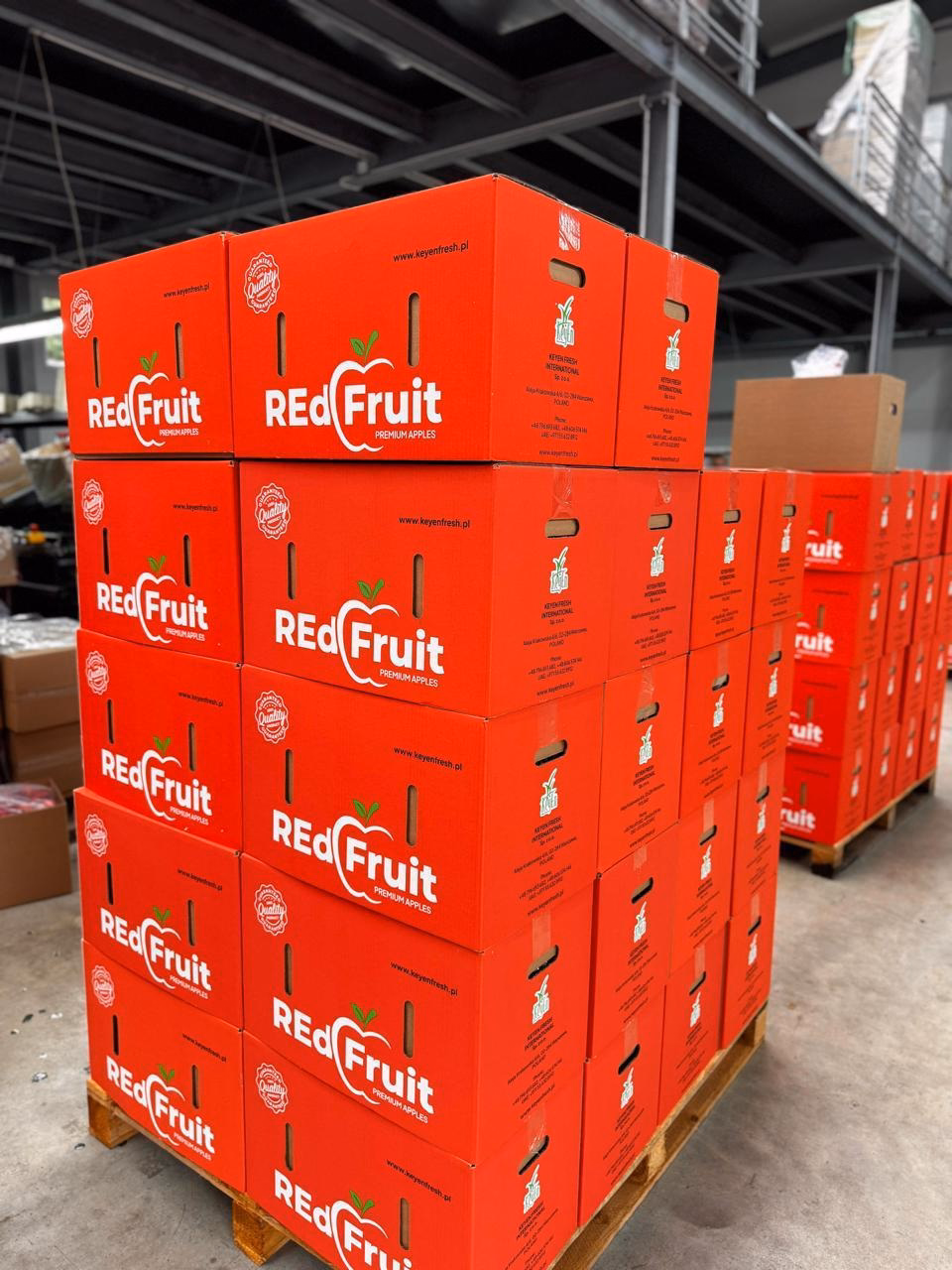 Branded crates stacked on pallets